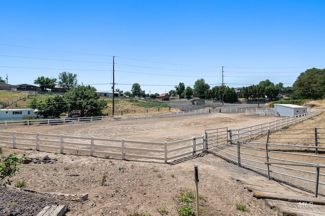 view of yard with a rural view