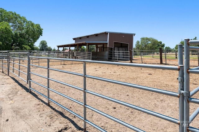 view of stable featuring a rural view