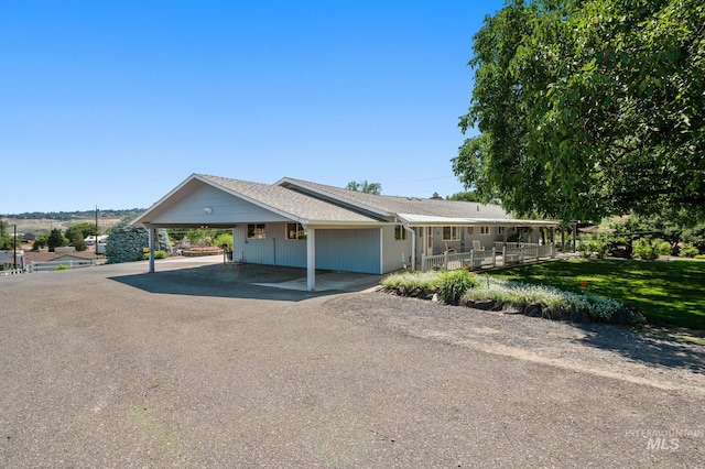 view of front of property with a carport