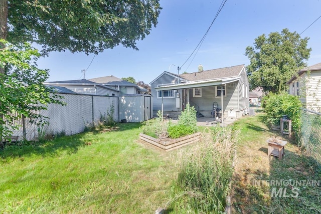 829 Diagonal, Clarkston, WA 99403 - rear view of house featuring a fenced backyard, a garden, a shed, and a patio