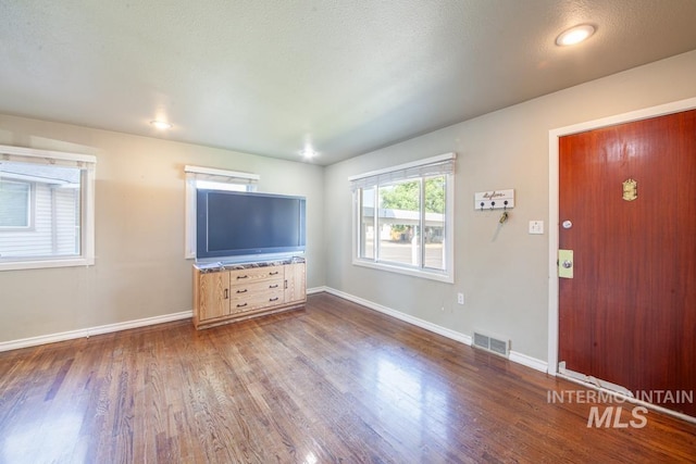 829 Diagonal, Clarkston, WA 99403 - unfurnished living room featuring wood finished floors and baseboards
