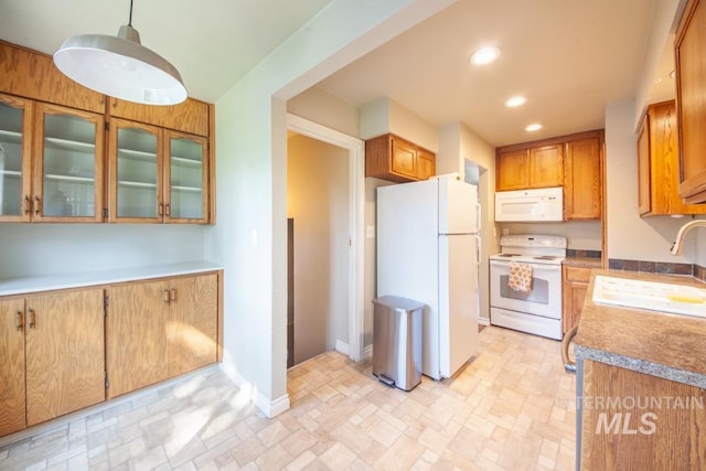829 Diagonal, Clarkston, WA 99403 - kitchen with white appliances, recessed lighting, brown cabinets, and glass insert cabinets