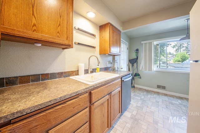829 Diagonal, Clarkston, WA 99403 - kitchen with stainless steel dishwasher and brown cabinets