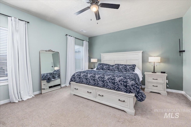 bedroom featuring carpet floors, baseboards, and a ceiling fan