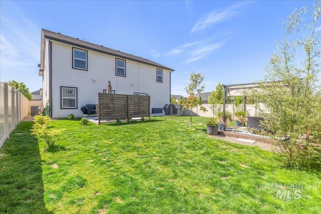 rear view of property featuring central AC and a patio area