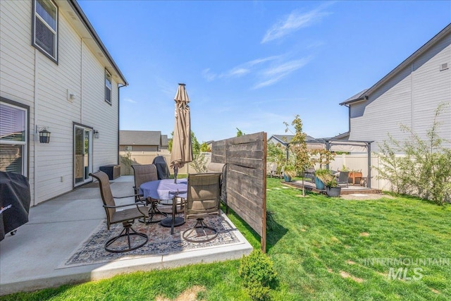 view of yard with a patio, central air condition unit, outdoor dining space, and a pergola