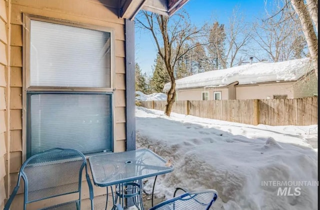 view of snow covered patio