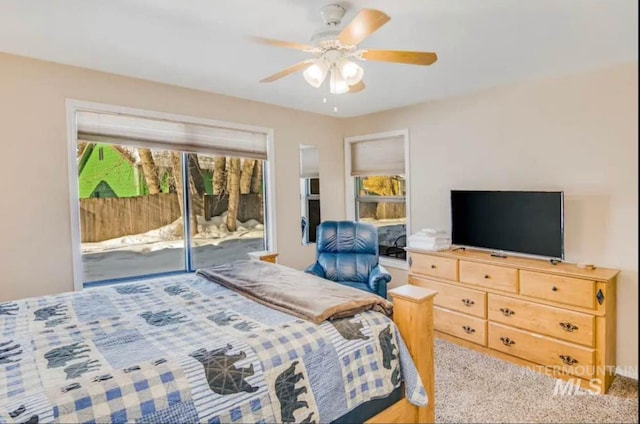 carpeted bedroom featuring ceiling fan and access to outside