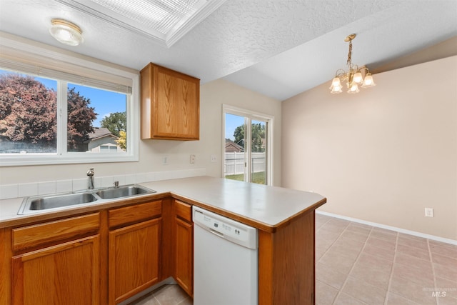 816 W Georgia Ave, Nampa, ID 83686 - kitchen with dishwasher, a sink, a peninsula, light countertops, and light tile patterned flooring