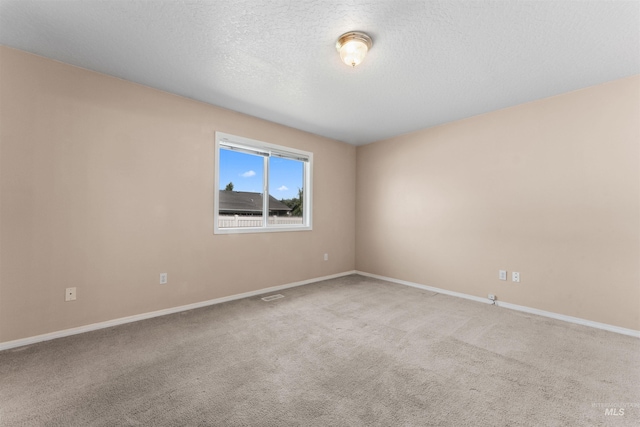 816 W Georgia Ave, Nampa, ID 83686 - carpeted empty room with baseboards and a textured ceiling