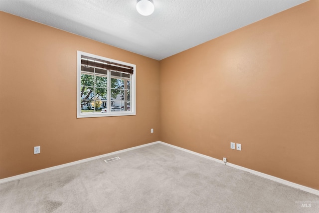 816 W Georgia Ave, Nampa, ID 83686 - unfurnished room with carpet flooring, baseboards, and a textured ceiling