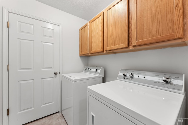 816 W Georgia Ave, Nampa, ID 83686 - laundry area featuring cabinet space, independent washer and dryer, and a textured ceiling