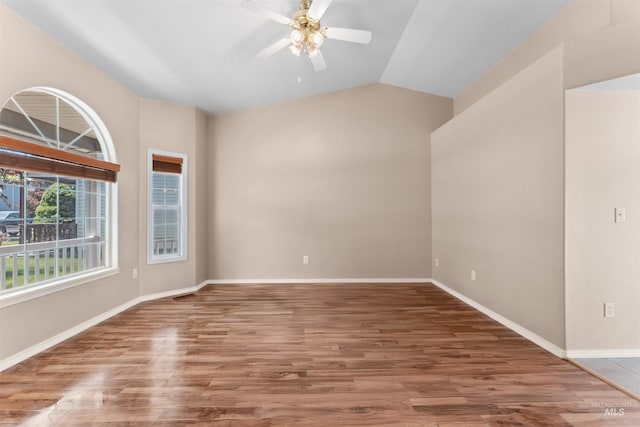816 W Georgia Ave, Nampa, ID 83686 - empty room with wood finished floors, a ceiling fan, vaulted ceiling, and baseboards