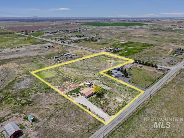 birds eye view of property featuring a rural view
