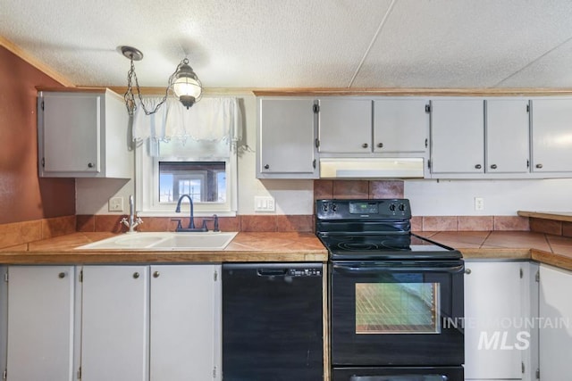 kitchen with a textured ceiling, white cabinetry, under cabinet range hood, a sink, and black appliances