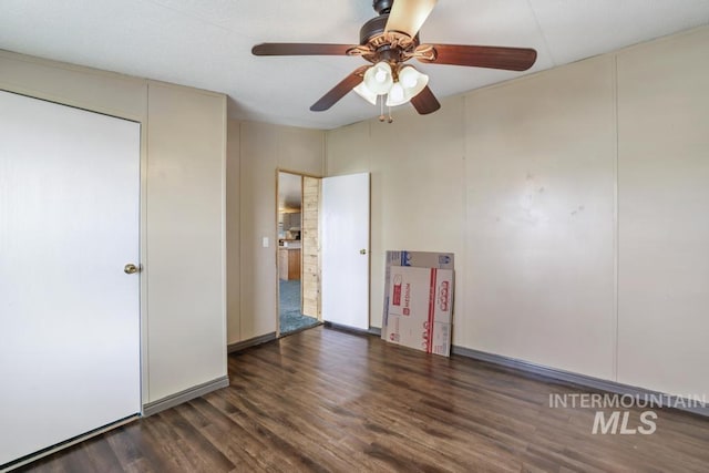 unfurnished room with ceiling fan and wood finished floors