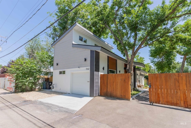 712 E Sheridan, Nampa, ID 83686 - view of front of home featuring asphalt driveway and a garage