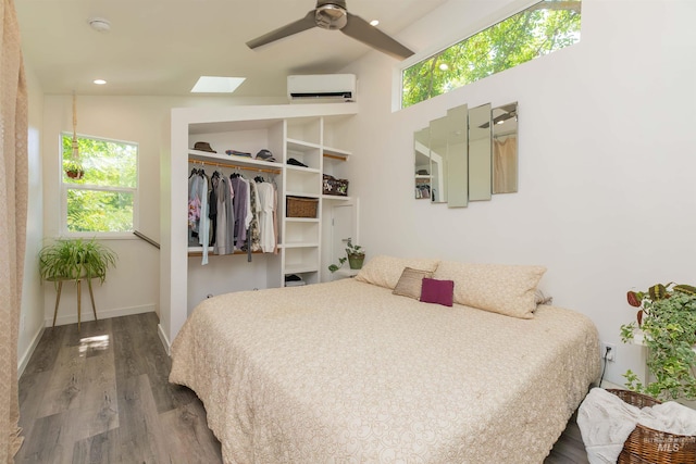 712 E Sheridan, Nampa, ID 83686 - bedroom with a wall mounted air conditioner, wood finished floors, a skylight, and a closet