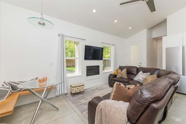 712 E Sheridan, Nampa, ID 83686 - living room with vaulted ceiling, recessed lighting, a glass covered fireplace, a ceiling fan, and concrete floors