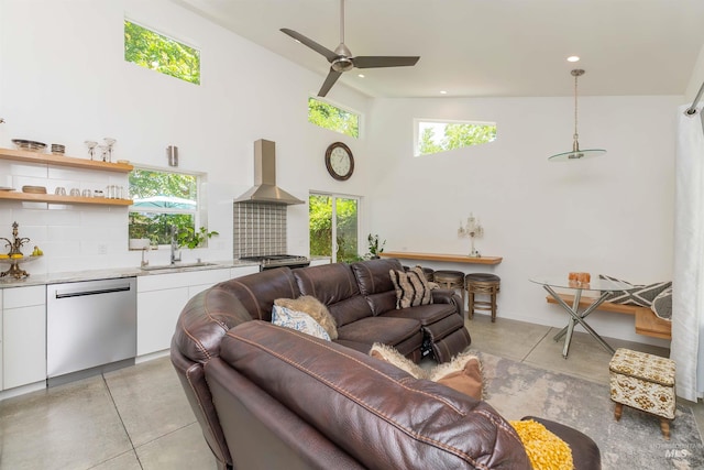 712 E Sheridan, Nampa, ID 83686 - living area with finished concrete flooring, a ceiling fan, a high ceiling, and recessed lighting