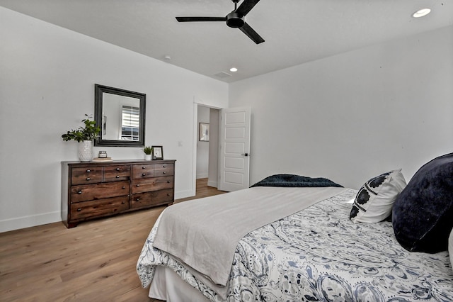 bedroom featuring visible vents, baseboards, light wood-type flooring, recessed lighting, and a ceiling fan