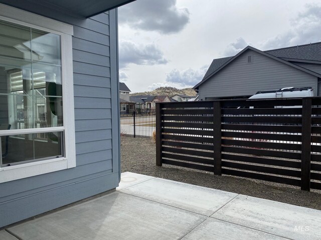 view of gate with fence