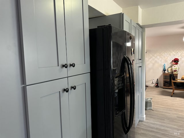 1111 SW 11th Ave, Ontario, OR 97914 - details featuring black fridge with ice dispenser and light wood-type flooring