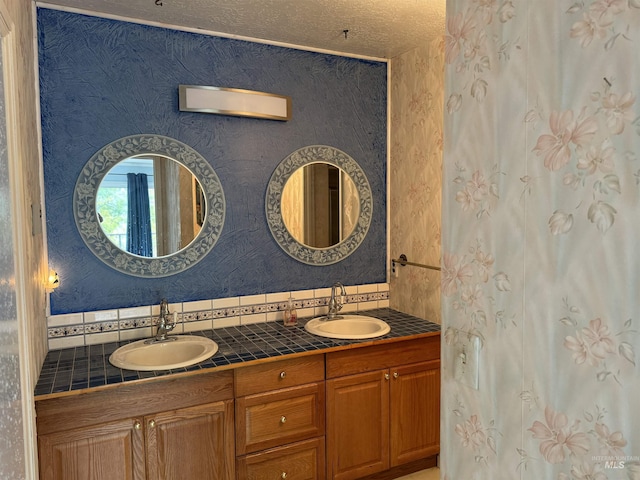 1111 SW 11th Ave, Ontario, OR 97914 - full bathroom with a sink, double vanity, and tasteful backsplash