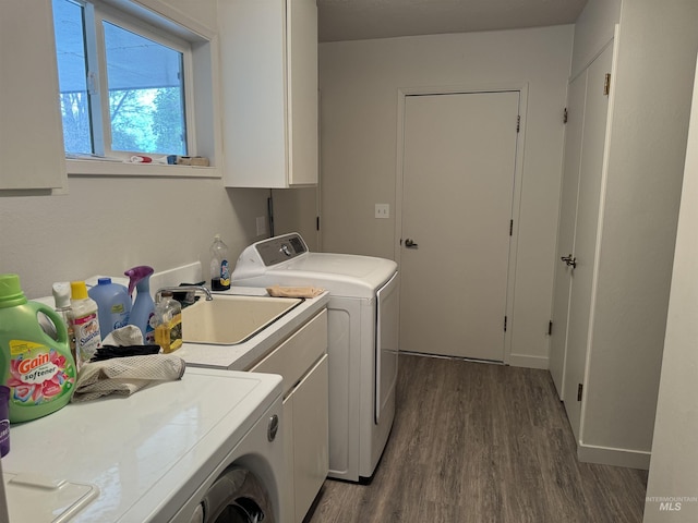 1111 SW 11th Ave, Ontario, OR 97914 - clothes washing area with cabinet space, dark wood finished floors, and washer and dryer