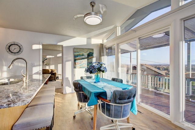 4420 N Ginzel St, Boise, ID 83703 - dining area with visible vents, lofted ceiling, and light wood finished floors
