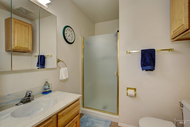 4420 N Ginzel St, Boise, ID 83703 - bathroom with vanity, toilet, visible vents, and a stall shower