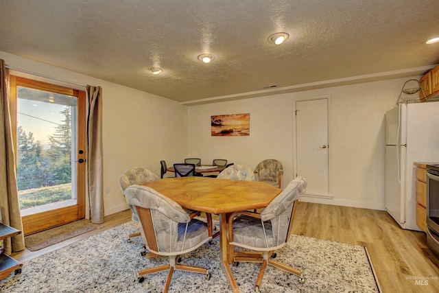 4420 N Ginzel St, Boise, ID 83703 - dining area featuring visible vents, light wood finished floors, and a textured ceiling