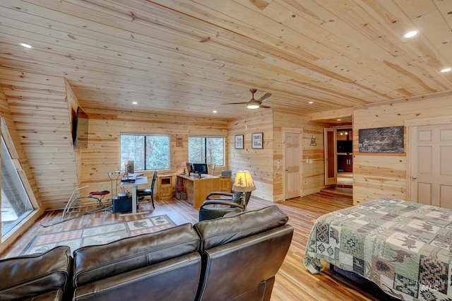 bedroom featuring light hardwood / wood-style flooring, multiple windows, wood walls, and wood ceiling