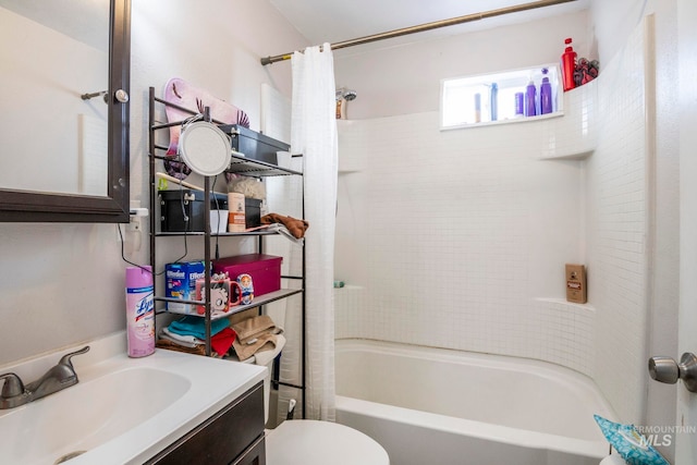 bathroom with vanity, shower / bath combo with shower curtain, and toilet