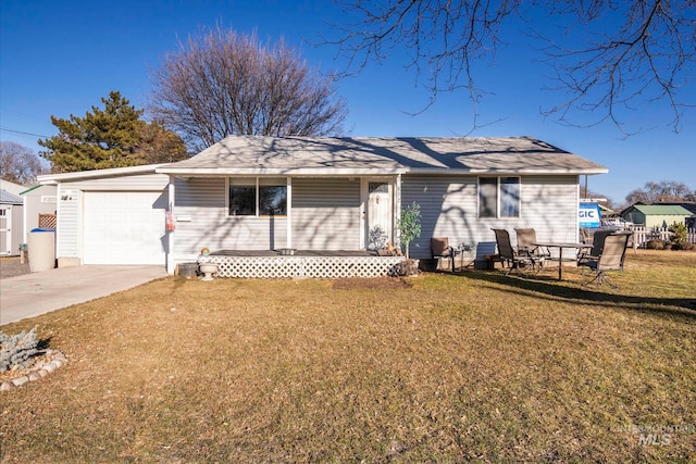 ranch-style house with driveway, an attached garage, and a front yard