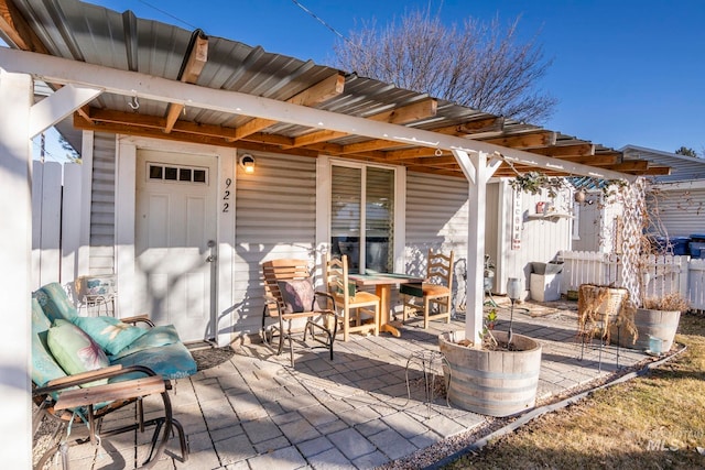 view of patio featuring fence and outdoor dining area