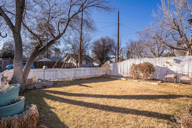 view of yard with a fenced backyard