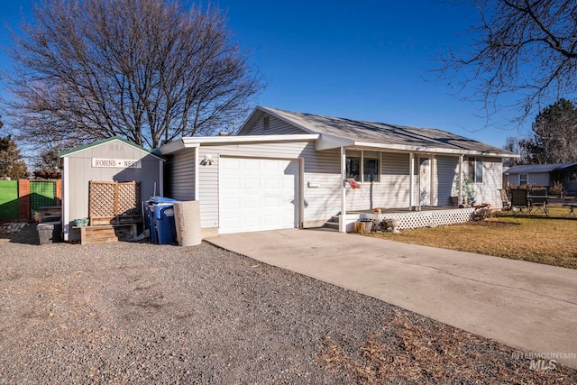 ranch-style house with driveway, a porch, an attached garage, and fence