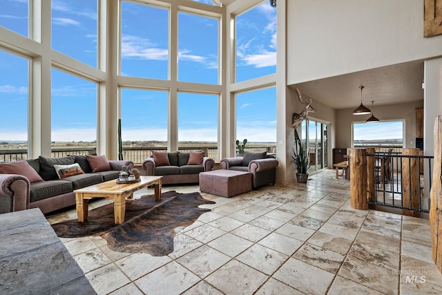 13331 Peaceful Way, Nampa, ID 83686 - living area with a high ceiling and stone tile flooring
