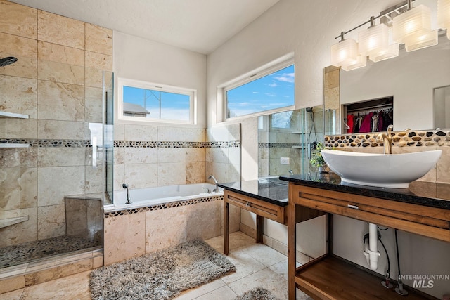 13331 Peaceful Way, Nampa, ID 83686 - full bath with a tile shower, a sink, tile patterned flooring, tile walls, and a bath