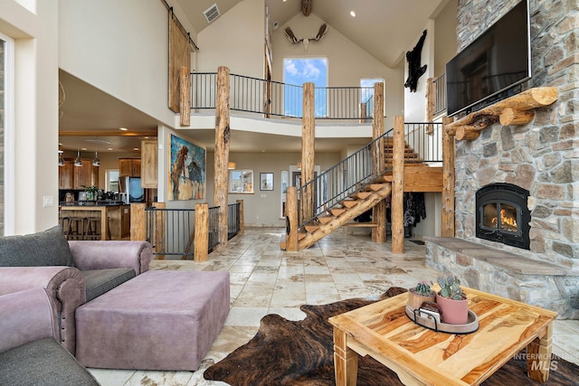 13331 Peaceful Way, Nampa, ID 83686 - living room featuring stairs, high vaulted ceiling, visible vents, and a fireplace