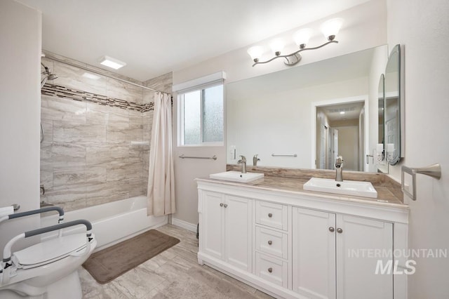 full bathroom with toilet, vanity, and shower / tub combo with curtain