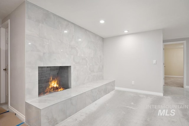 interior space with light colored carpet and a fireplace