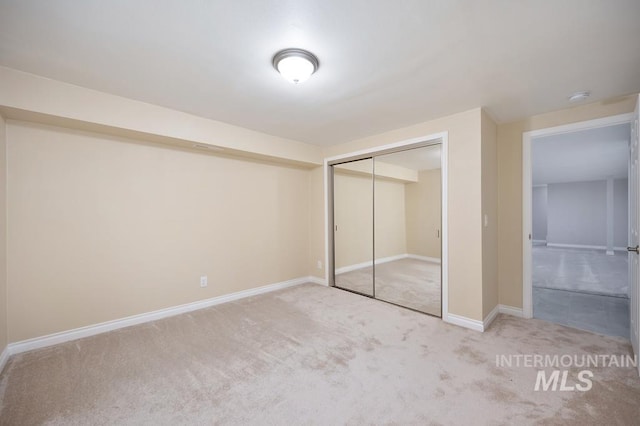 unfurnished bedroom with carpet floors and a closet