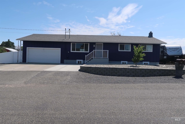 2405 23rd St, Clarkston, WA 99403 - single story home with an attached garage, driveway, a chimney, and roof with shingles