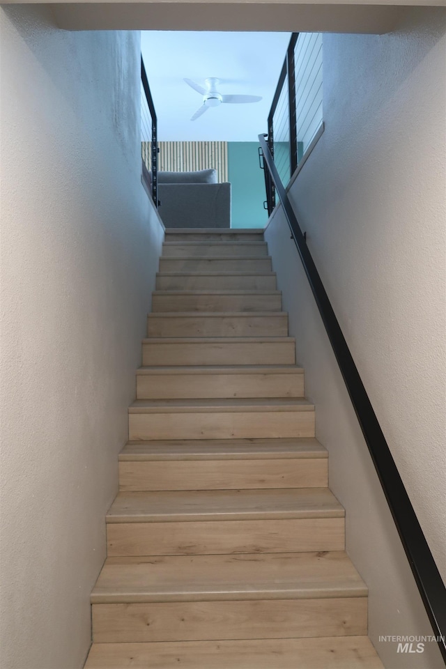 2405 23rd St, Clarkston, WA 99403 - stairs featuring a textured wall and a ceiling fan