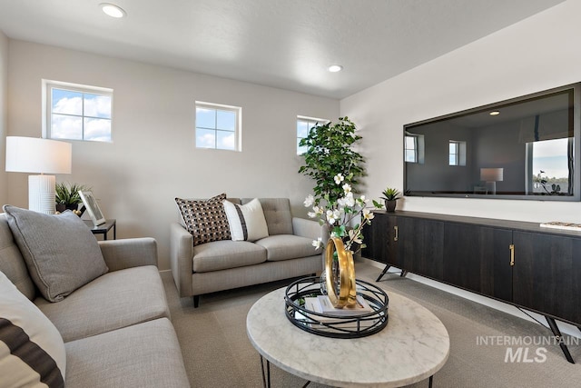 living room featuring recessed lighting and carpet floors