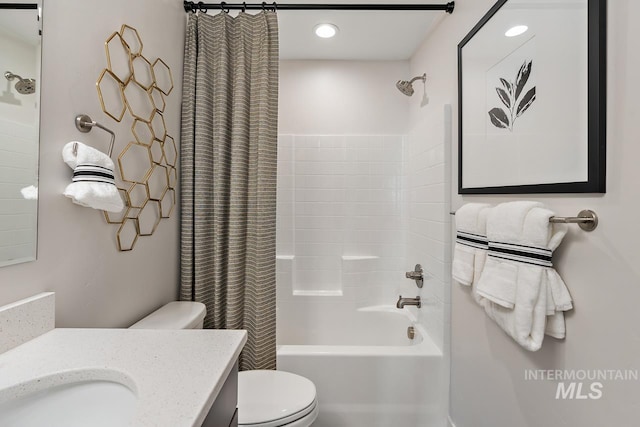 bathroom with recessed lighting, shower / bath combination with curtain, toilet, and vanity