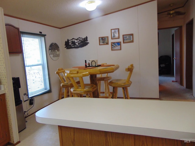 dining area with crown molding