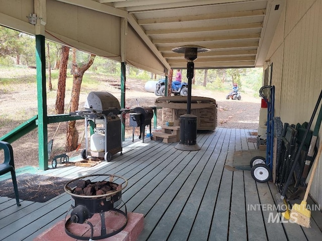 wooden deck featuring area for grilling